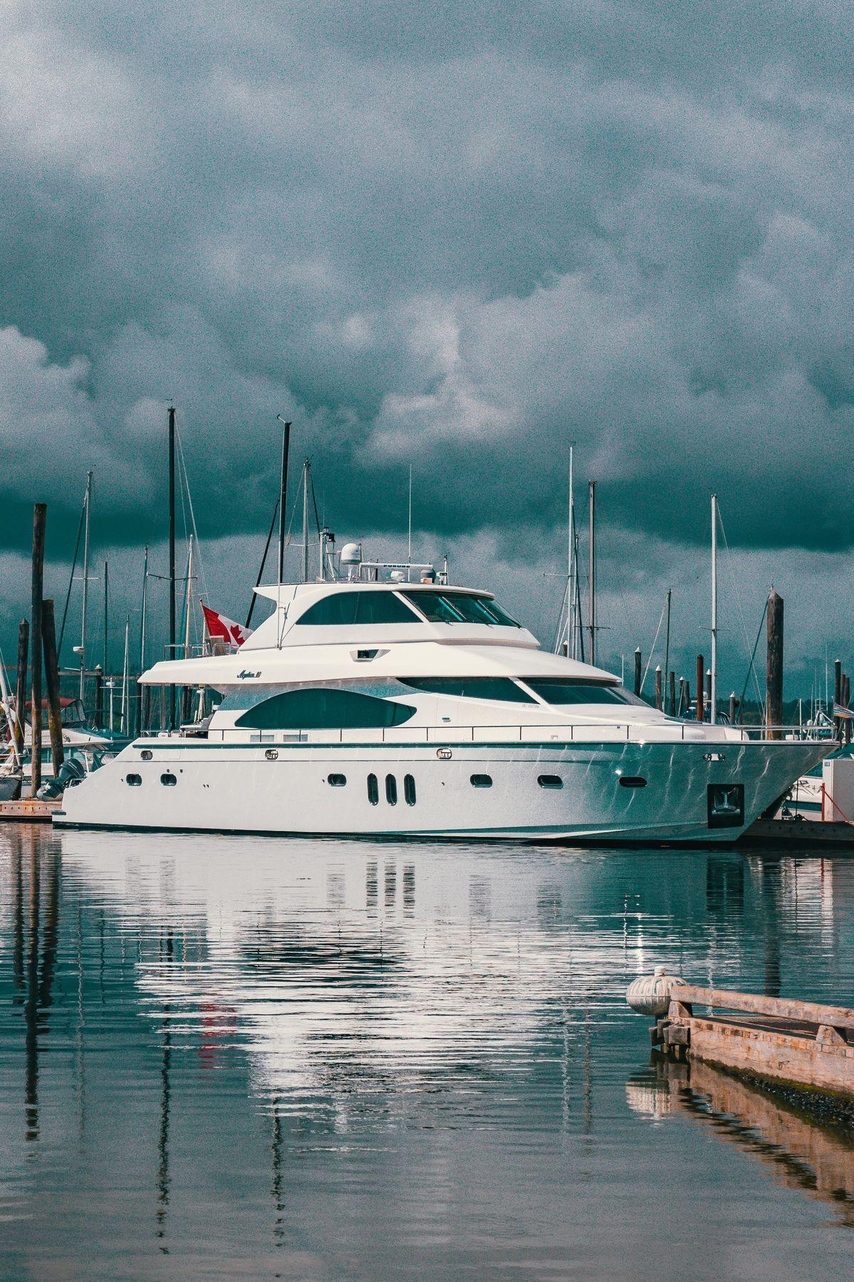 white boat on dock during daytime